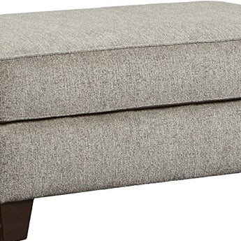 Camero Platinum Ottoman: A contemporary grey ottoman with plush fabric upholstery, perfect for adding a touch of sophistication to any space.