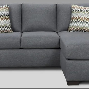 Experience the ultimate comfort with this Cosmopolitan Grey Sleeper Sofa. Accent pillows included.