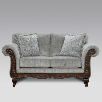 Relax in comfort with Emma Slate Grey Loveseat. Its grey fabric, carved feet, & rolled arms provide superior comfort.
