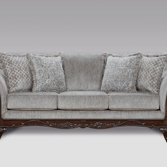 Relax in luxury with the Emma Slate Grey Sofa, boasting fabric upholstery, curved arms, and carved wood feet.