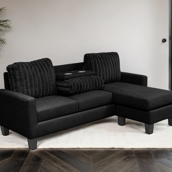 Neymar black corduroy reversible sectional with drop-down tray.