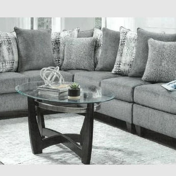 Relax with family or entertain friends in style and comfort with the Tori Sectional. Plush loose back cushions and luxurious slate gray upholstery provide the perfect seating and décor.