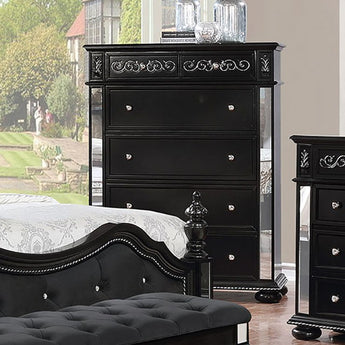 Azha Black Chest features floral faux wood carvings and felt lined top drawer. Case goods shine as mirrored accents glimmer against the black finished.