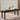 Cilgerran Dining Bench in Gray. Featuring fabric upholstered padded seat with nailhead trim.