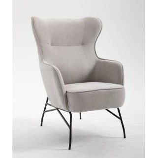 Franky Accent Chair in Tan/ A soft and supple faux leather with piped edges and stitching detail sits atop black metal legs creating a contemporary look that is rich and inviting!