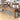 Gianna Wooden Bench in Rustic Oak. The weathered finish of the bench draws attention to the sturdy solid wood framework while providing the necessary support for a worry-free dinner setting. Plank design.