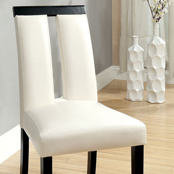 Luminar Dining Chair in Black and White color. Beautifully crafted side chair with padded leatherette seats. Slit back design. Includes 2 pieces per box. Complete your dining room with its matching Luminar dining table.