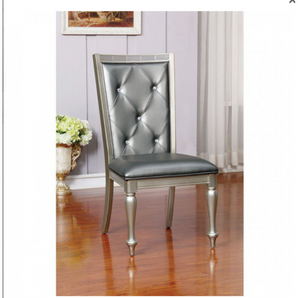 Sarina Leatherette Side Chair in Silver- leatherette and solid wood, buttontufted chair backs, padded leatherette cushions, turned legs