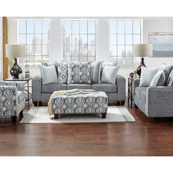 Grey Sofa and Loveseat. Box-style seat cushions with multiple contrasting accent pillows.
