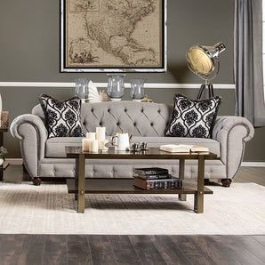 Viviana Glam Sofa in Gray- features the same classic deep tufting, the nailhead trim, and rolled arms