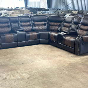 Black reclining sectional with diamond stitching
