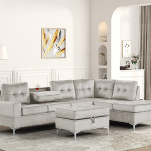 Anserra light grey velvet reversible sectional with a drop-down cup holders and storage ottoman.