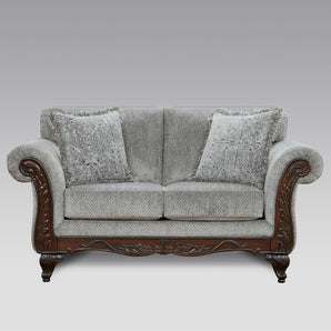 Relax in comfort with Emma Slate Grey Loveseat. Its grey fabric, carved feet, & rolled arms provide superior comfort.
