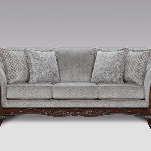 Relax in luxury with the Emma Slate Grey Sofa, boasting fabric upholstery, curved arms, and carved wood feet.