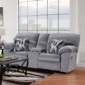Relax in style with the Kynance Grey Reclining Loveseat. Luxurious grey fabric and 100% polyester with a middle console make this loveseat perfect for your living room.