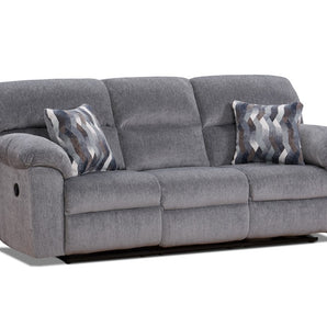 Experience luxury and style with the Kynance Grey Reclining Sofa! Upholstered in soft grey fabric, it's 100% polyester for ultimate comfort. Two accent pillows included.