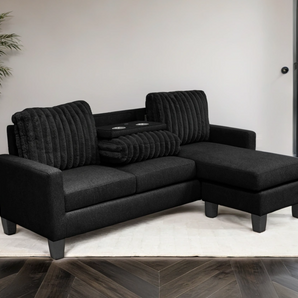 Neymar black corduroy reversible sectional with drop-down tray.