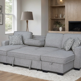 Sahara gray fabric sectional with double storage chaise and drop down cup holder table.