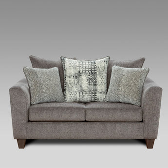 The Tori Slate Grey Loveseat is perfect for a living space. Upholstered in an inviting slate grey, it has a timeless style.