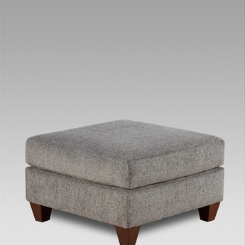 Experience comfort and modern elegance with the Tori Slate Grey Ottoman! Upholstered with plush fabric and featuring a minimalist design, this stylish ottoman adds a touch of luxury to any home. 