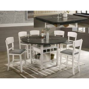 Conner Dining 5pc Set - Chalk Grey. The table expands from 46" square to 60" round with 4 drop leaves. Dual lower shelves on the table for display and storage options. Faux leather upholstery on chairs. This set includes 1 Table and 4 Chairs. With built-in lazy Susan for easy access.