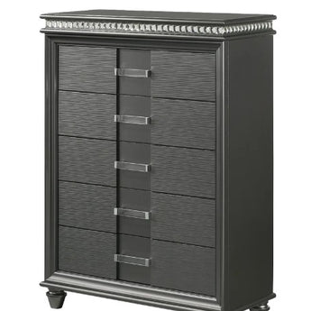 An Adira dark gray chest of drawers with five spacious drawers, each featuring silver-tone handles, and a sleek, modern design with clean lines that complements any bedroom decor.