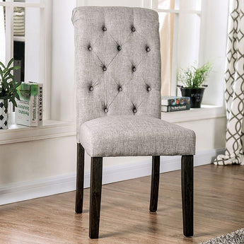 Alfred Side Chair in Antique Black/Light Gray. I features a padded seats and button-tufted backs that will give your dining room a rustic aesthetic feels.