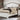 Alyson Bed in Distressed White/Walnut. A distressed-white finish highlights this Alyson bed that establishes a mood of antique integrity. Planked design and arched headboard. Made of sold wood and wood veneer.