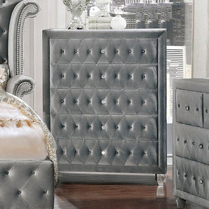 Alzir Grey Chest. Comforting cushioned velvet-like fabric encompasses this chic Alzir chest. It has a crystal like acrylic buttons and five storage drawers.