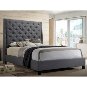 Chantilly Gray Upholstered Bed. This upholstered style bed screams luxury. Beautiful and inviting gray tufted upholstery and chrome nailhead details along sides of the headboard.