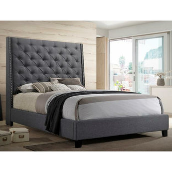 Chantilly Gray Upholstered Bed. This upholstered style bed screams luxury. Beautiful and inviting gray tufted upholstery and chrome nailhead details along sides of the headboard.
