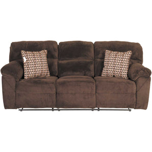 Chevron Mink Reclining Sofa. t features a cushioned pub-style back, over-padded arms, velvety chocolate-colored upholstery with a unique chevron texture, and a reclining mechanism for infinite comfort possibilities.