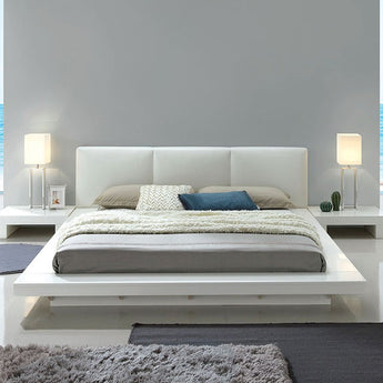 Christie California King Bed in White. The high gloss white finish brightens any setting while enhancing the bed’s padded headboard and low-profile design. 