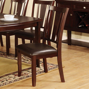 This transitional dining chair from Townsend Collection will be an attractive addition to any dining space.  Finished in dark espresso and padded leatherette seat. Includes 2 pieces per box.