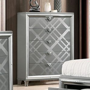 Emmeline 5-Drawer Chest in Silver. Made of solid wood and wood veneer. Features embossed art deco pattern, five drawer and  acrylic legs