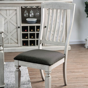 Georgia Side Chair in Antique White. These country-inspired chairs are cozy and homey. Classically shaped table legs create a traditional visual. The gray fabric and dark nailhead are composed and bring that warm rustic charm to your dining set.