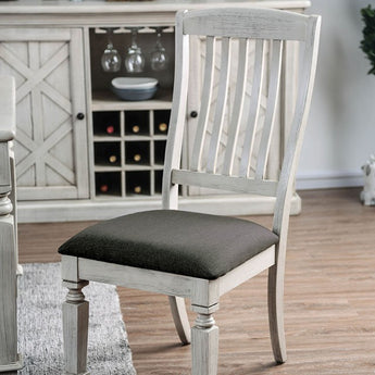 Georgia Side Chair in Antique White. These country-inspired chairs are cozy and homey. Classically shaped table legs create a traditional visual. The gray fabric and dark nailhead are composed and bring that warm rustic charm to your dining set.