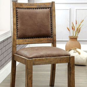 Gianna Rustic Side Chair in Oak. Bold & sturdy design. Features upholstered seat and nailhead trim