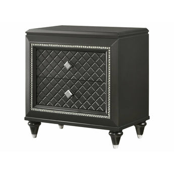 Giovani Black 2-Drawer Nightstand. It comes in a dark finish and features silver accents, carving detailing, two drawers that are perfect for keeping bedtime books or cell phones.
