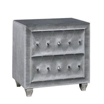 Alzir Button Tufted Nightstand in Grey. Comforting cushioned velvet-like fabric encompasses this chic nightstand. It has two storage drawers and cabriole feet.