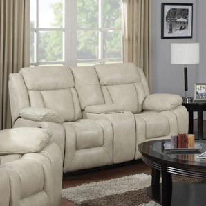 Hudson Beige Reclining Loveseat. It features a sectioned back with a defined headrest, a pad-over-chaise made of memory foam for added comfort, and pillow arms. It is adorned with beautiful brown contrast stitching accents. It also features a center storage console with two cup holders.