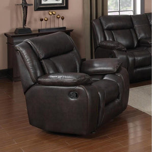 Hudson Brown Rocker Recliner. It features a sectioned back with a defined headrest, a pad-over-chaise made of memory foam for added comfort, and pillow arms. It is adorned with beautiful brown contrast stitching accents.