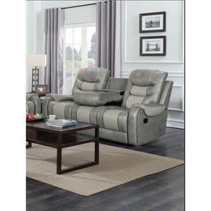 Starwood Grey Reclining Sofa upholstered in a very durable leather with nailhead trim.