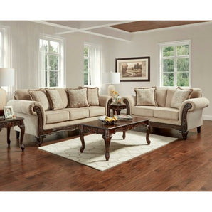 Emma Wheat  Sofa and Loveseat features rolled arms, carved wood feet, and lavishly carved wood front rail. Accent pillows included. 